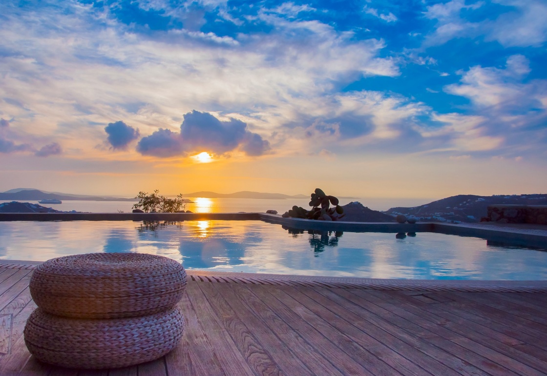 'The reflection of the beautiful clouds in the pool at sunset and the island ... Greece.' - Santorin